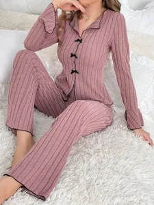 Soft and warm two-piece ribbed knit pajama set for women in elegant dusty pink color