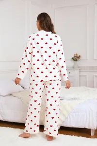 Detailed back view of women's plus-size white pajamas featuring cute red heart prints.