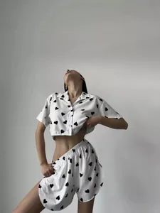 Close-up detail of women's heart-print crop top and shorts two-piece sexy pajama set