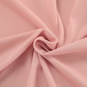 Close-up macro detail of soft breathable pink ribbed knit fabric texture for loungewear