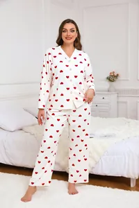 Cozy plus size waffle knit pajama set with red heart prints in bedroom setting