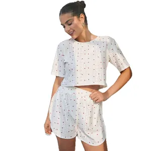 Two-piece soft women's summer knit pajama set with short sleeves and red heart print shorts