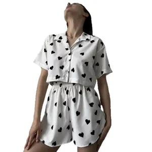 Two-piece women's pajama set featuring a heart print crop button-down and shorts