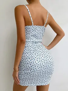 Back view detail of a slim-fit white floral camisole dress with ribbed texture.