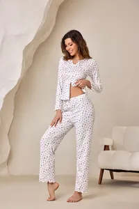 Detail view of women's floral print pajama set with ruffled edges and V-neckline