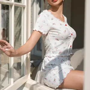 Floral two-piece pajama set with short sleeve button-up top and ruffled shorts for women