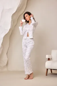 Full length view of a women's dainty floral pajama set with V-neck cardigan and ruffles