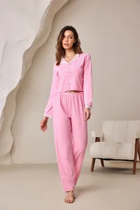Full view of pink ribbed pajama set with elegant lace collar and small bow accents