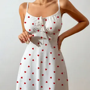 Sexy white cami nightdress featuring a red heart print and delicate front bow tie detail