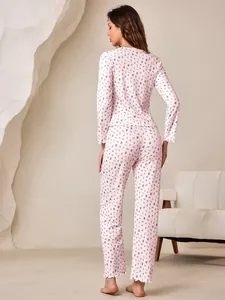 Back view of floral long sleeve pajama set with delicate ruffled hem detailing.