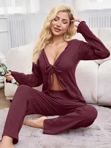 Sexy burgundy tie-front long sleeve pajama set for women shown in lifestyle setting