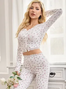 Detailed view of floral print loungewear set with delicate lace trim on sleeves and hem.