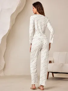 Back view of floral print long-sleeve pajama set with lettuce edge detail.