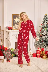 Red Christmas pajama set with snowflake and candy cane patterns in a festive setting.