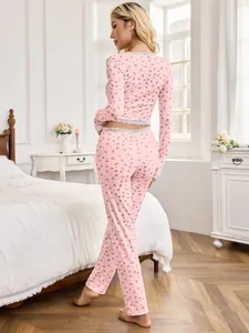Elegant floral pink pajama set with lace trim and slim fit long sleeve design for women