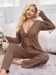 Detail view of brown long-sleeve tie-front pajama top with textured knit fabric