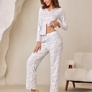 Two-piece floral pajama set with V-neck long sleeve button-up top and ruffled hem pants