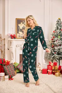Women's festive dark green Christmas pajama set featuring snowflake and candy cane prints