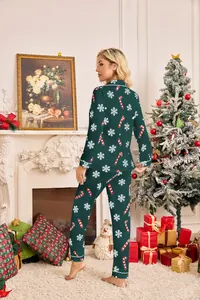 Back view of women's green Christmas pajamas set with snowflake and candy cane patterns