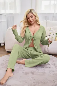 Full view of women's green tie-front 2-piece loungewear set in a cozy home setting