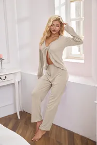Detail of beige ribbed two-piece loungewear set with tie-front cardigan and pants