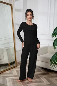 Close-up of black ribbed long-sleeve pajama set with button detail and lettuce edge trim