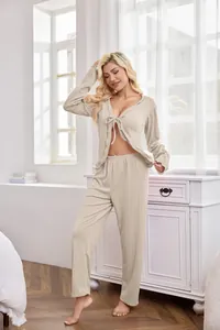 Detail view of women's beige waffle knit pajama set with tie-front cardigan and pants