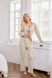 Detail view of women's two-piece beige loungewear set with tie-front cardigan and pants