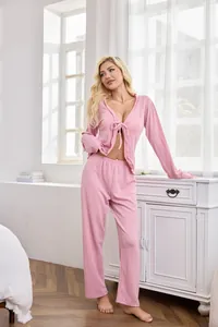 Two-piece pink loungewear pajama set for women featuring long sleeves and tie-front top