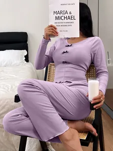 Slim fit purple pajama set for women featuring delicate bow tie details on the top