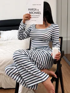 Comfortable blue and white striped long-sleeve pajama set for women in bedroom lifestyle