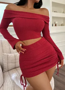 Detail of the red ribbed off-the-shoulder knit crop top and matching mini skirt set