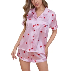 Women's pink and white striped satin pajama set with red heart patterns and lapel