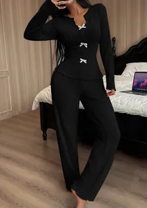 Black ribbed V-neck knit loungewear set featuring delicate white bow accents.