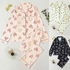 Detailed overview of women's long sleeve heart print pajama set available in three colors