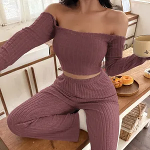 Cozy women's mauve ribbed knit off-the-shoulder crop top and long pants loungewear set