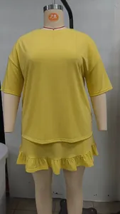 Plus size yellow two-piece set including short sleeve top and ruffled mini skirt