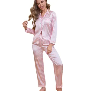 Elegant pink striped satin pajama set with long-sleeved button-up top and matching pants