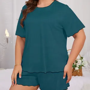 Detail view of a teal summer short sleeve loungewear set with decorative lettuce trim edges