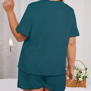 Back view of teal solid color round neck short sleeve loungewear set with scalloped edge