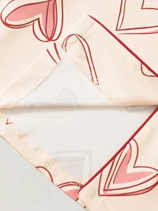 Close-up view showing the high-quality inner stitching and pink heart print on pajama hem