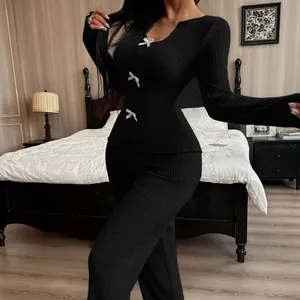 Elegant black ribbed knitted pajama set with V-neck and white bow details for home use.