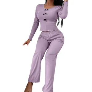 Women's lavender lounge set with long sleeves, pants and delicate black bow ties