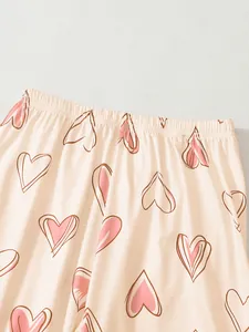 Detailed macro view of elastic waistband on ladies pink heart pattern pajama trousers