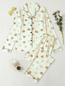 Detail view of women's long sleeve pajamas set featuring a cute heart print pattern