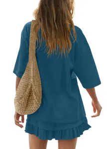 Back view of a casual blue oversized T-shirt and ruffled mini skirt two-piece set.