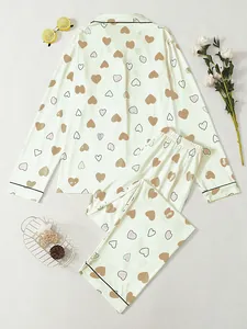 Elegant women's heart print pajama set featuring long sleeves and lapel design