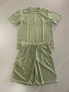 Detail flat lay of men's sage green summer two-piece lounge set with t-shirt and shorts