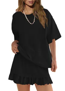 Detail of black solid short sleeve T-shirt and ruffle skirt set for women.