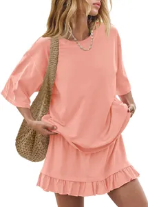 Detail view of peach two-piece casual set with oversized tee and ruffled mini skirt.